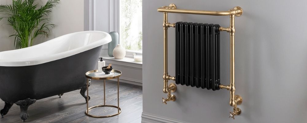 Wall mounted classic towel rail in gold with black radiator