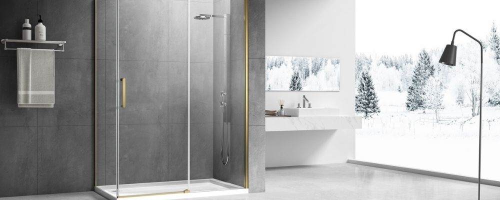 Corner sliding door shower in brushed brass